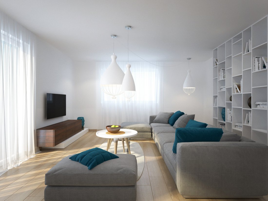 Obývačka s veľkou látkovou sedačkou, výrazne farebnými vankúšmi, nástennou TV a s vysokou bielou knižnicou a visiacimi lustrami