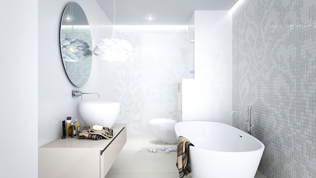 Biela kúpeľňa s vaňou a záchodom spestrená kachličkovou mozaikou a visiacim lustrom